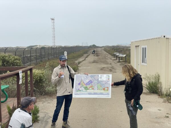 Pete Dixon (TNC) explaining future restoration plans at Ormond Beach. Photo by Katie Haldeman.